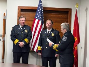 Middleton Township Fire Chief Steve Asmus (right) administers the oath of office to EMS Chief Jerry Saunders (center) and Assistant Chief Ron Bogedain (left).
